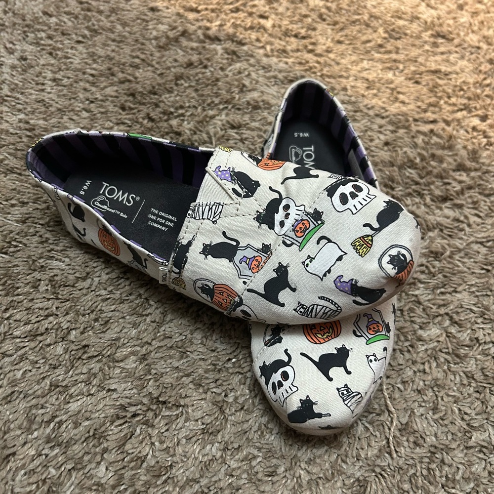 TOMS Cream Slip-Ons with Halloween Motifs
